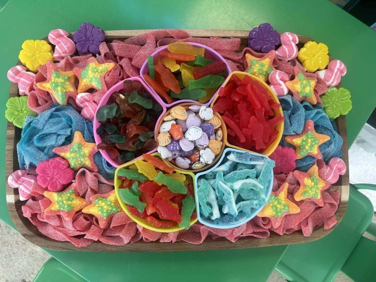 A tray of candy is shown with different colors.