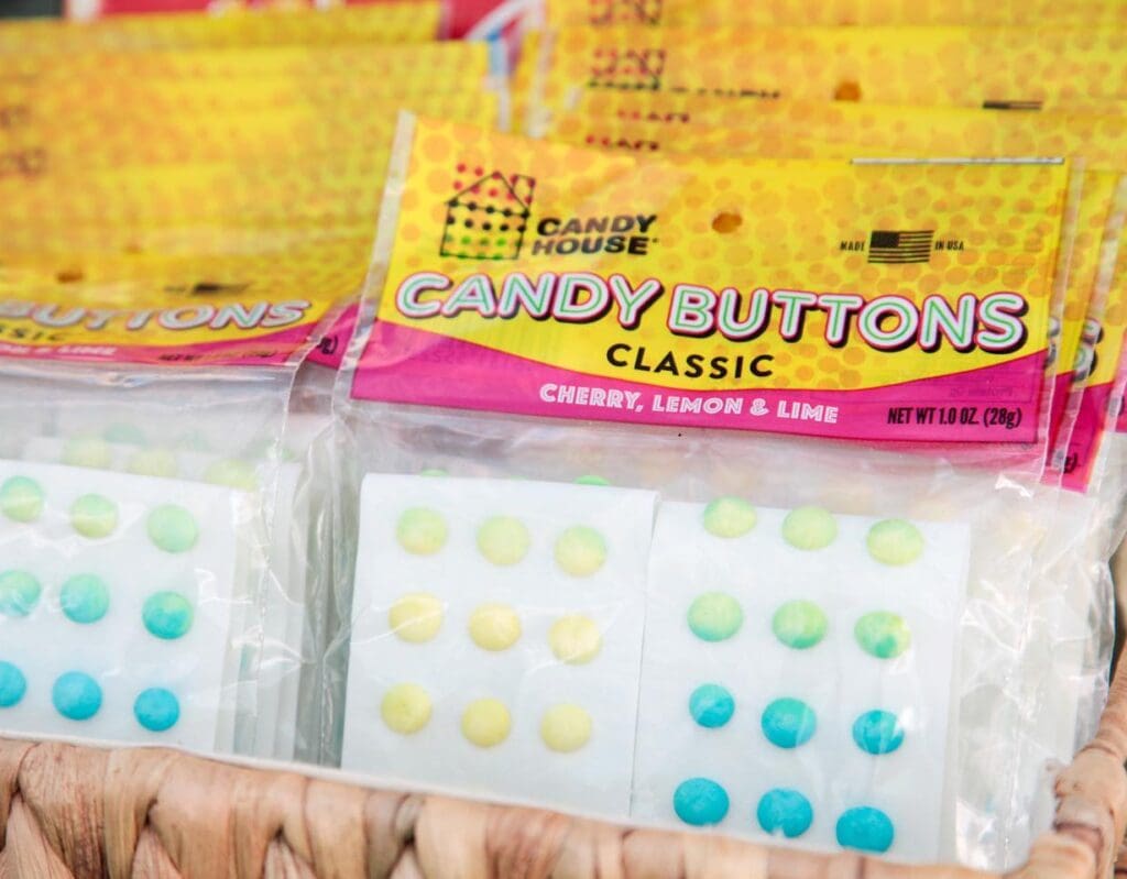 A close up of candy buttons in packages