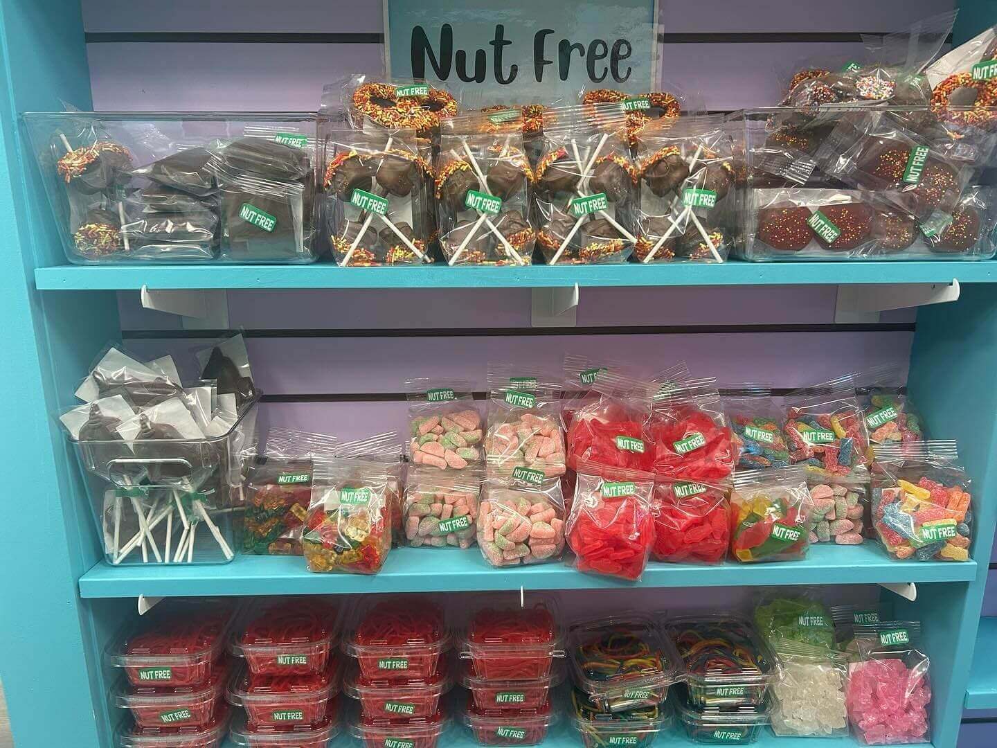A display of nuts and other foods on shelves.