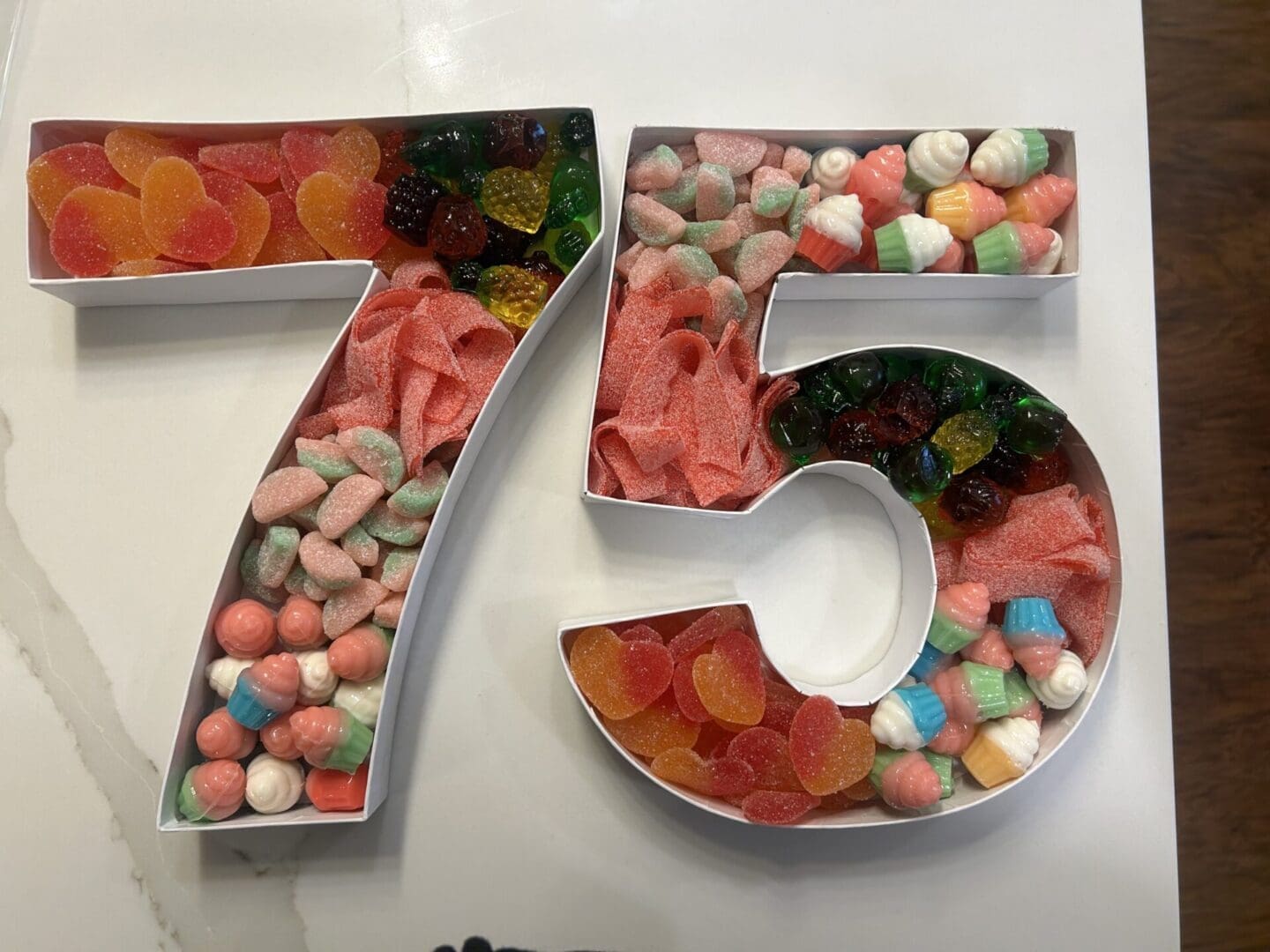 A number 7 5 with candy in it