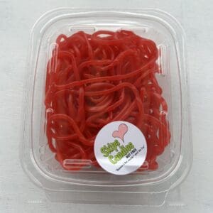 Plastic container filled with bright red licorice candy.