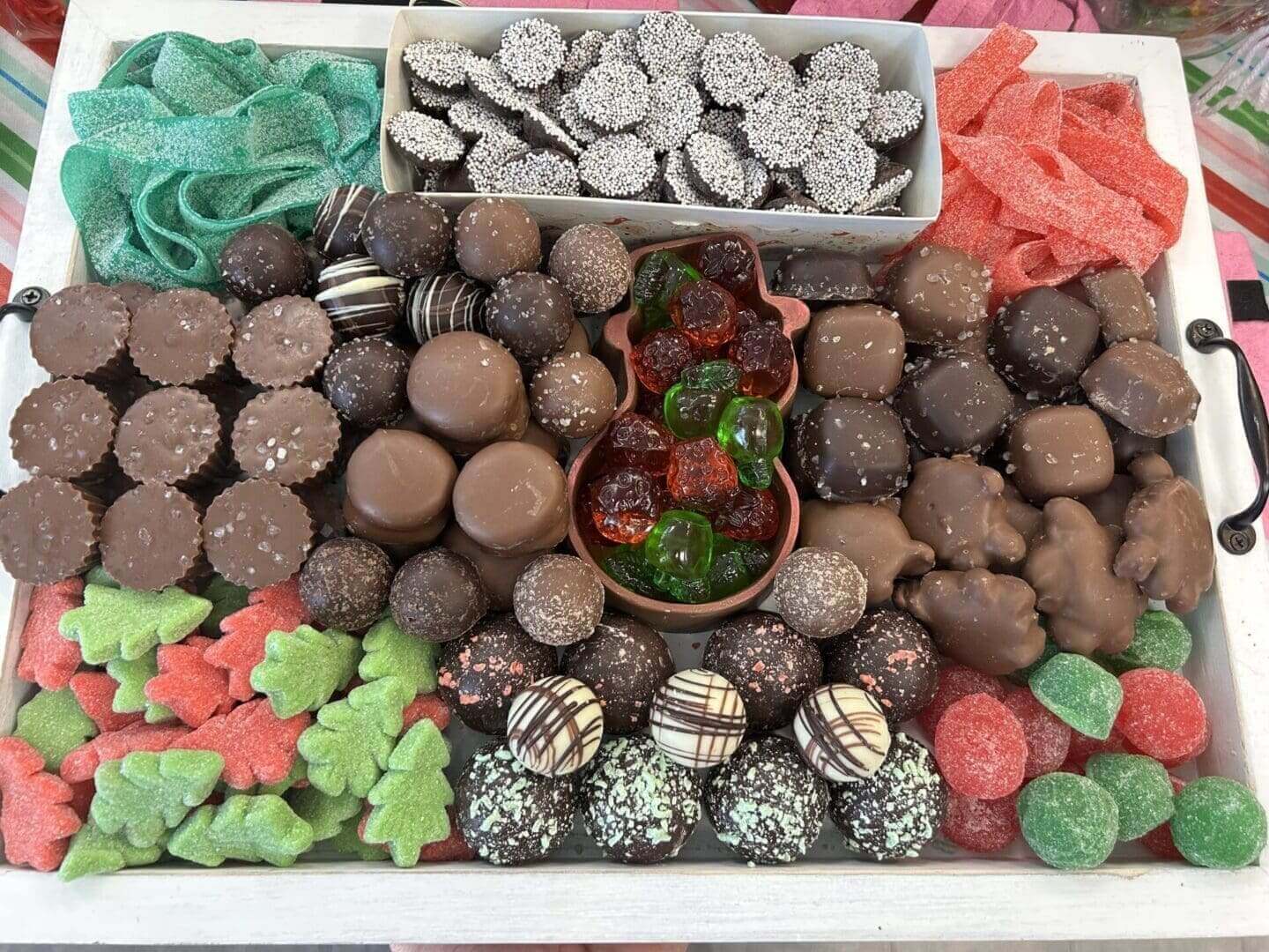 A large tray of assorted candies and chocolates.
