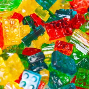 A close up of gummy bears in different colors