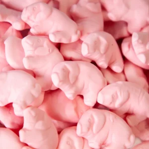A pile of pink elephants that are in the shape of pigs.