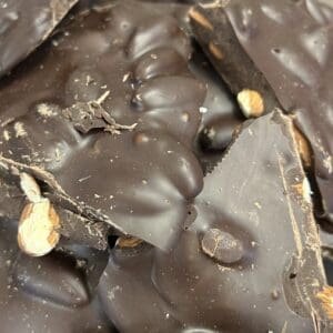 Close-up of chocolate bark with nuts embedded.
