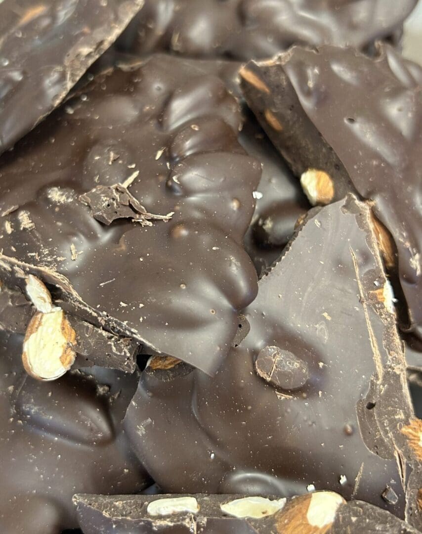 Close-up of chocolate bark with nuts embedded.