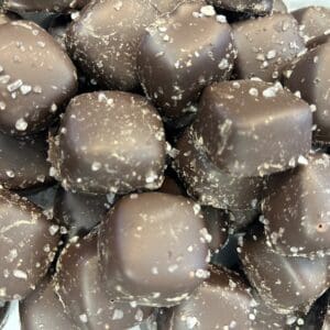 Close-up of sugar-coated chocolate sweets piled together.