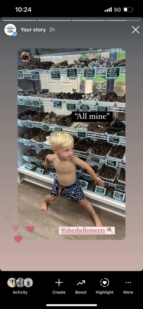A toddler grabbing berries with a determined look saying "All mine."