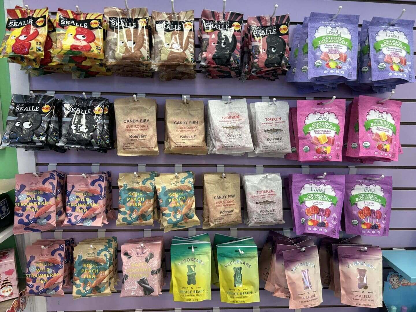 Colorful packets of snacks or treats displayed on shelves.