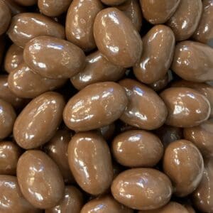Close-up of shiny chocolate-covered almonds.