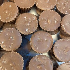 Close-up of peanut butter cups with a chocolate coating.
