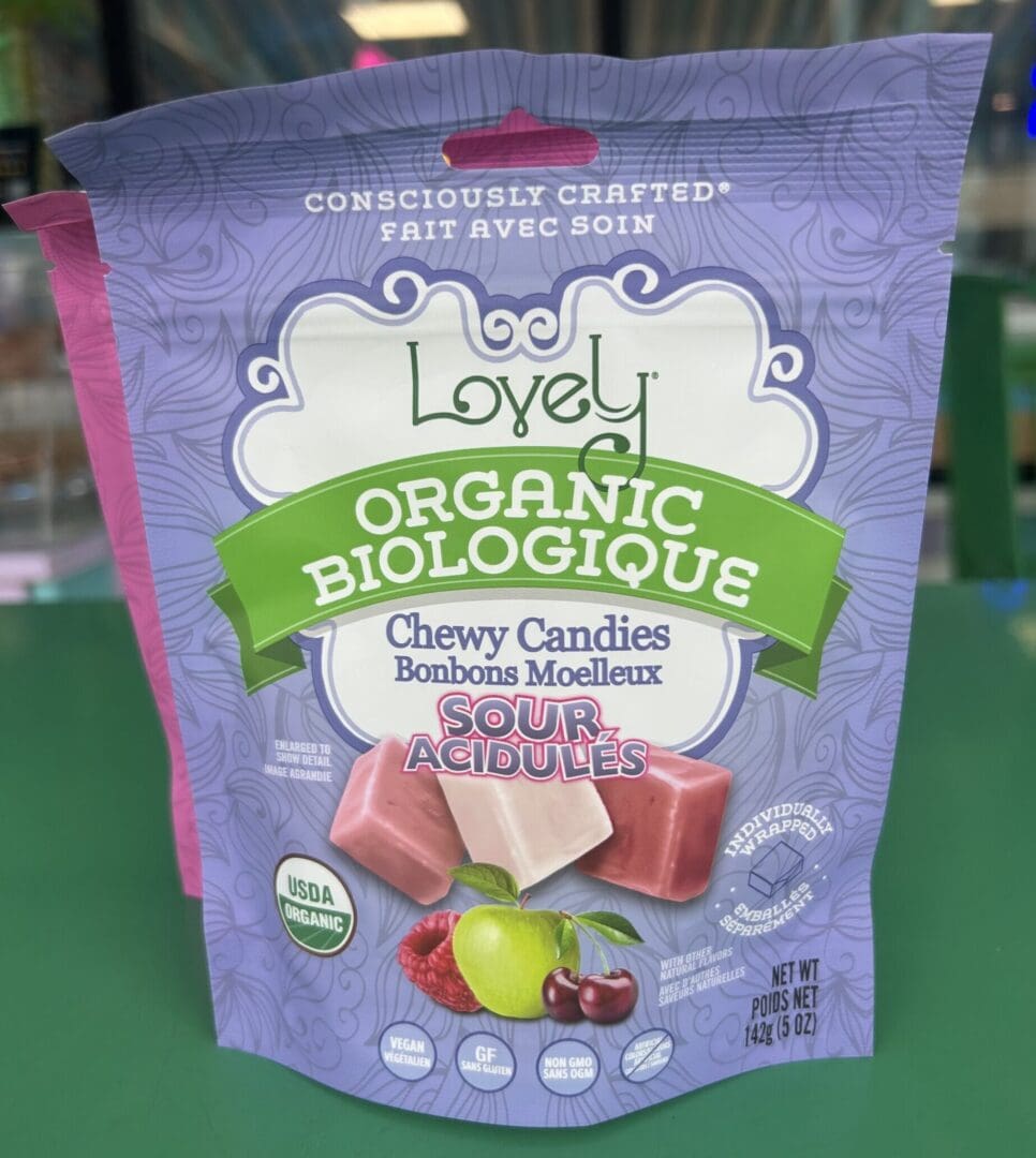 A bag of Lovely Organic chewy candies with mixed fruit flavors.