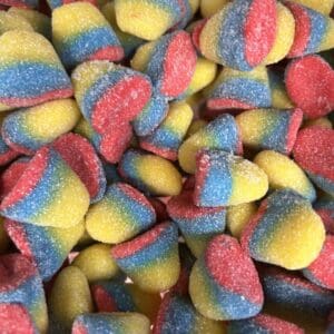 Colorful sugar-coated gummy candies in red, blue, and yellow.