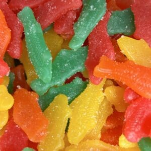 Close-up of colorful gummy candies coated in sugar.