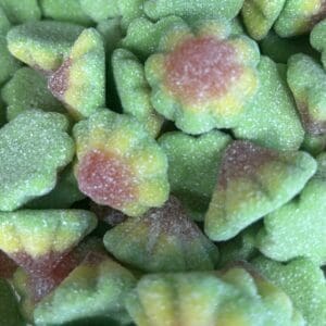 Close-up of green and pink sugar-coated gummy candies.