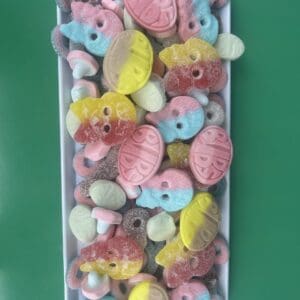 Colorful gummy candies in various shapes and pastel colors.