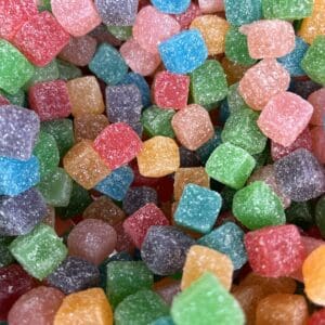 Colorful sugar-coated gummy candies piled together.